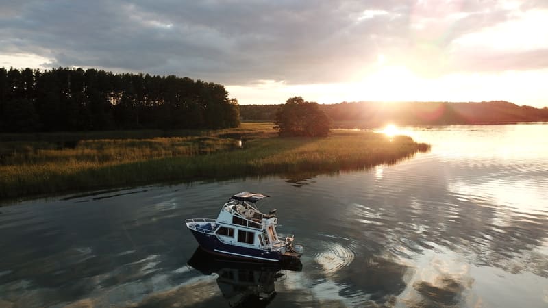 Sunset over Lake Necko with the moored houseboat